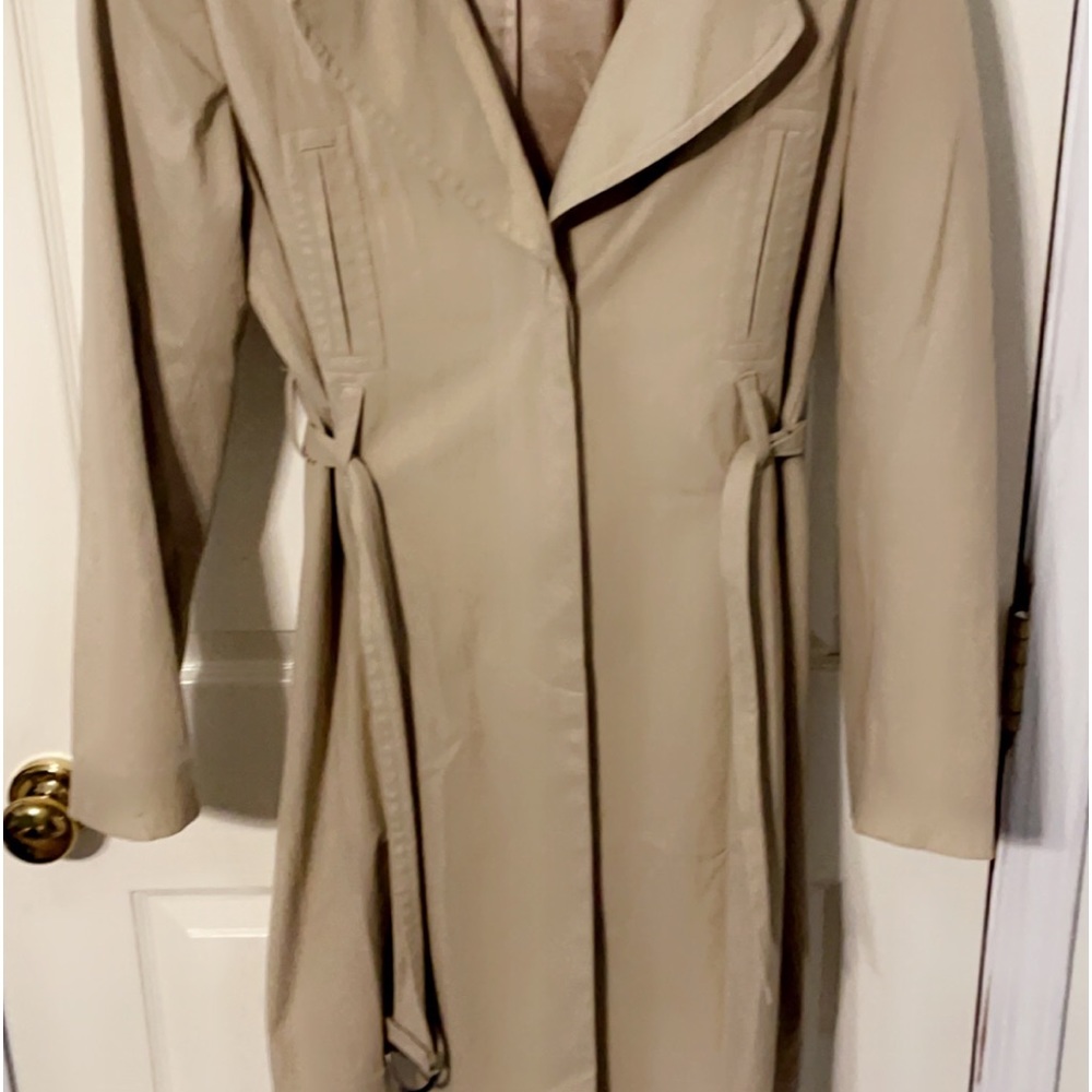 Beige Trench coat with pleat, water resistant. All buttons and belt included.